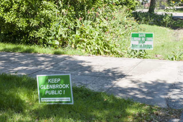 Yard signs near pedestrian entrance to Glenbrook Golf Course. Photo by Paul Hester.